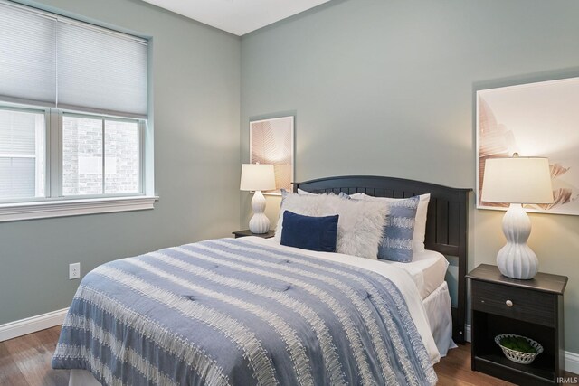 54637 Burdette St Unit 2, South Bend, IN 46637 - bedroom with baseboards and wood finished floors