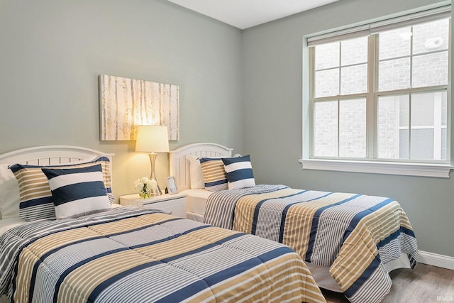 54637 Burdette St Unit 2, South Bend, IN 46637 - bedroom featuring baseboards and wood finished floors