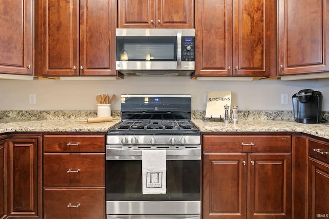 54637 Burdette St Unit 2, South Bend, IN 46637 - kitchen with light stone countertops and appliances with stainless steel finishes