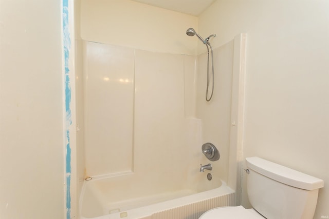 full bath with shower / bath combo with shower curtain and toilet