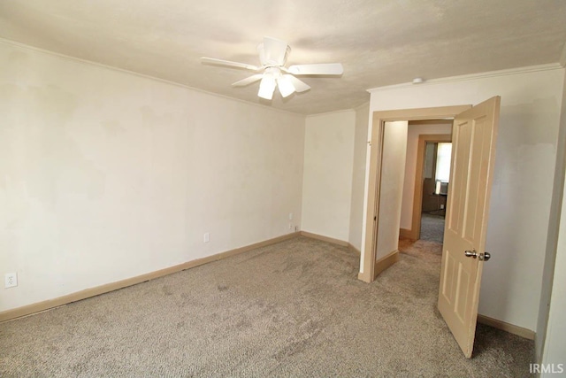 2813 W Franklin St, Evansville, IN 47712 - spare room with baseboards, ornamental molding, a ceiling fan, and light colored carpet