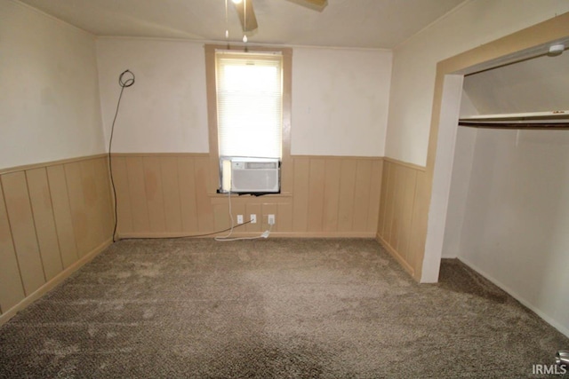 2813 W Franklin St, Evansville, IN 47712 - unfurnished bedroom featuring carpet floors, a closet, a wainscoted wall, cooling unit, and a ceiling fan