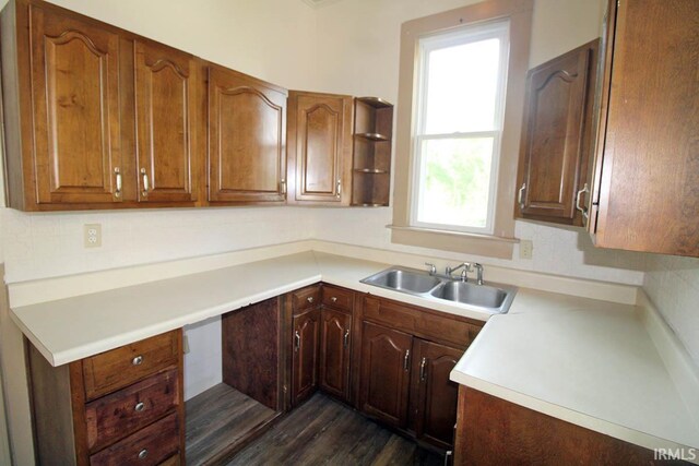 2813 W Franklin St, Evansville, IN 47712 - kitchen with a sink, light countertops, and dark wood finished floors