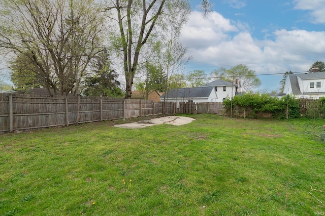 view of yard with a fenced backyard and a patio area