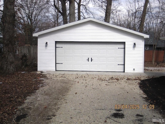 detached garage with fence