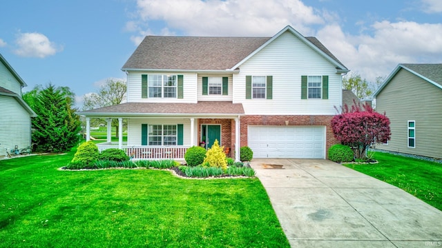 traditional home with a front lawn, an attached garage, brick siding, a porch, and driveway