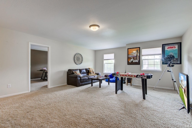 game room with baseboards and carpet flooring