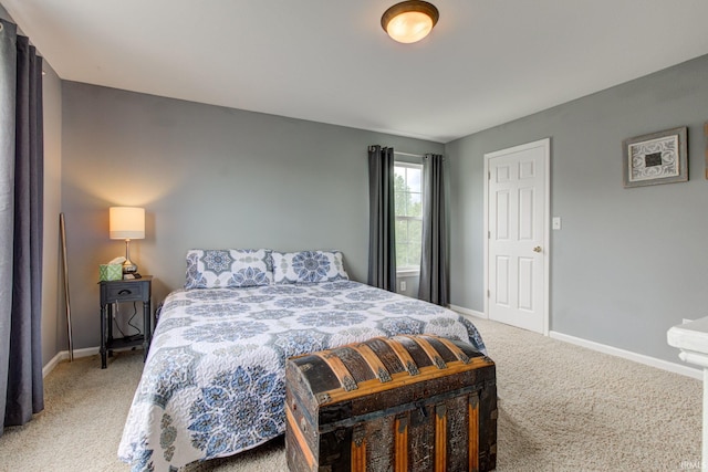 carpeted bedroom with baseboards