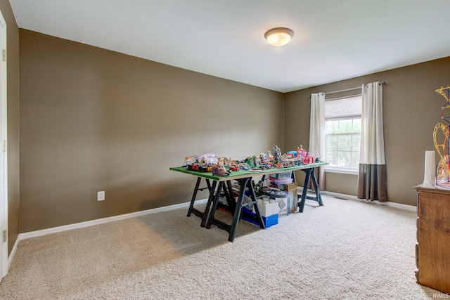 dining room with baseboards and carpet