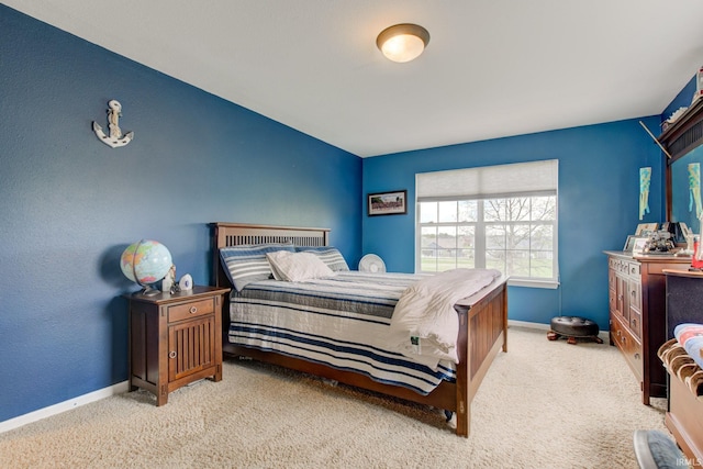bedroom with baseboards and carpet floors