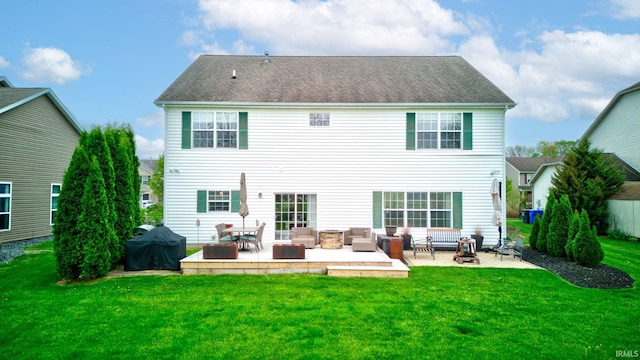 rear view of property with a yard and an outdoor hangout area