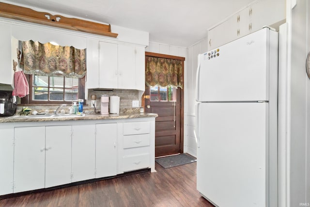 1901 Keck Ave, Evansville, IN 47711 - kitchen featuring freestanding refrigerator, decorative backsplash, white cabinetry, a sink, and dark wood finished floors