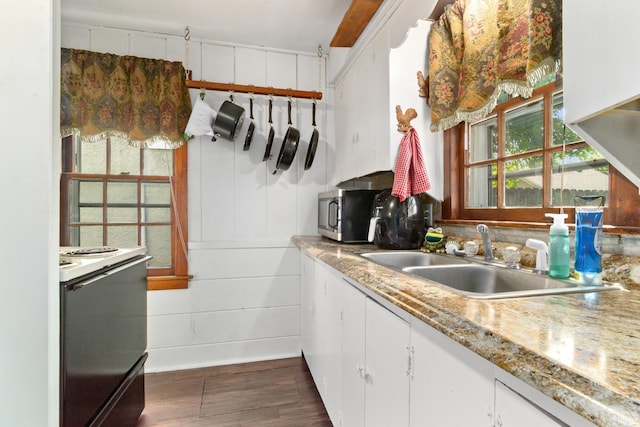 1901 Keck Ave, Evansville, IN 47711 - kitchen with dark wood-style flooring, stove, stainless steel microwave, white cabinets, and a sink