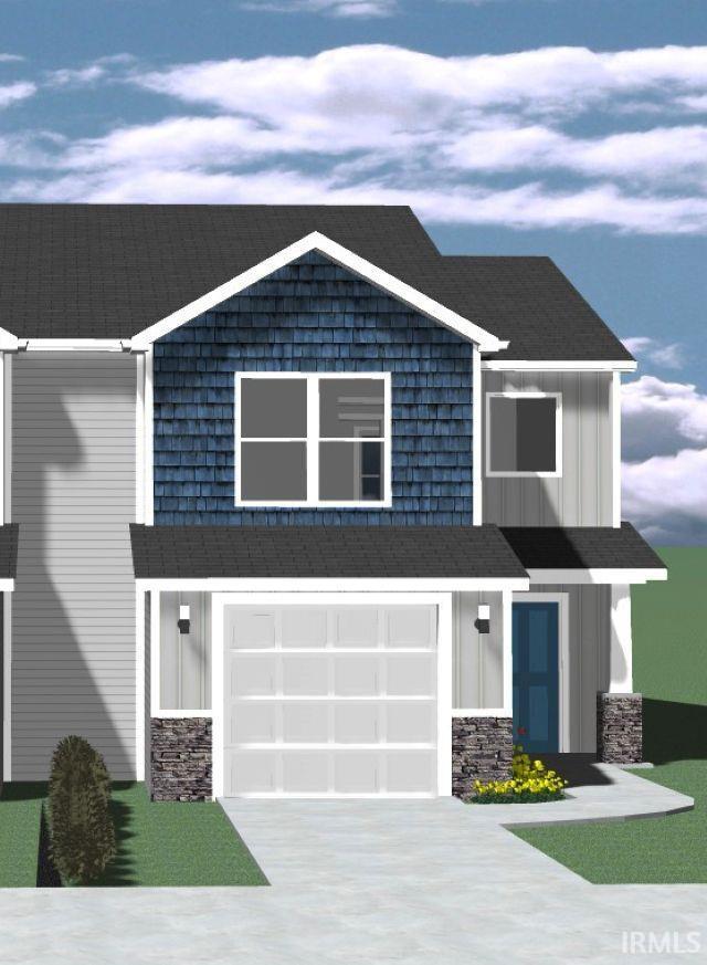craftsman-style home featuring an attached garage, board and batten siding, driveway, and stone siding