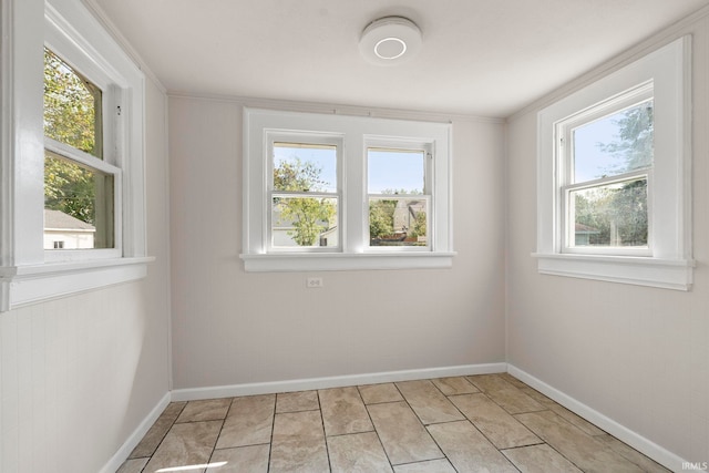spare room featuring baseboards