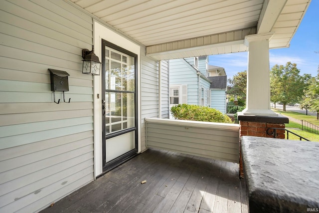 wooden deck featuring covered porch