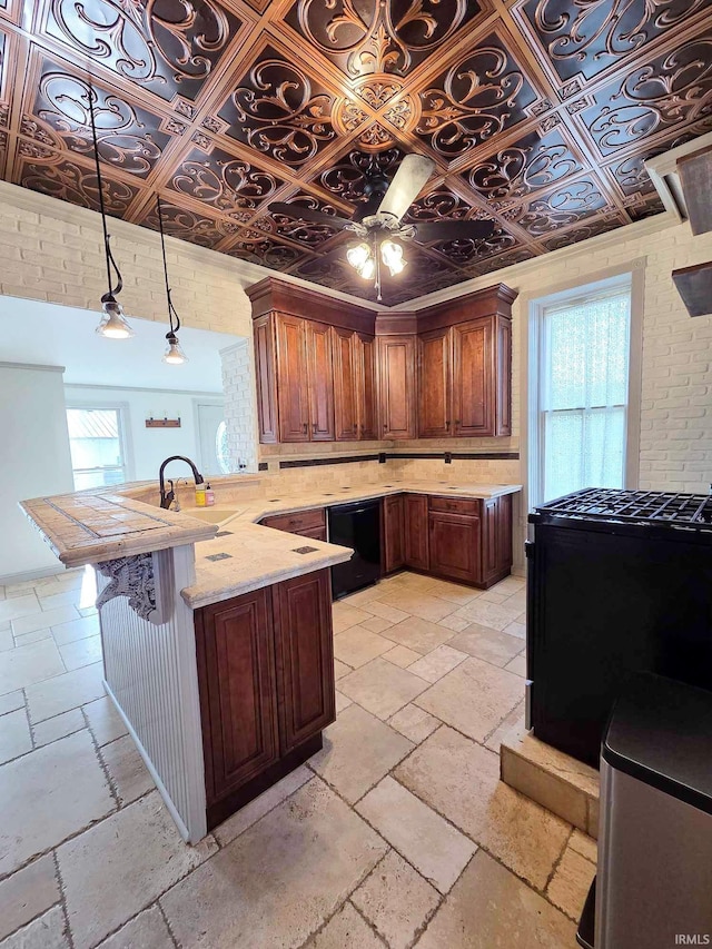 1106 E 5th St, Fowler, IN 47944 - kitchen with light stone countertops, a sink, dishwasher, a peninsula, and stone tile flooring