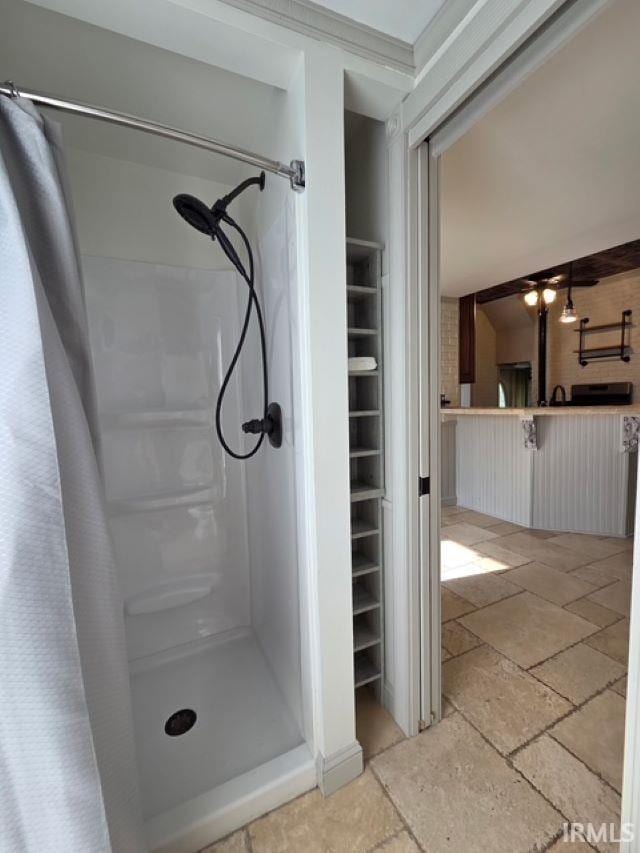 1106 E 5th St, Fowler, IN 47944 - bathroom featuring a stall shower and stone tile floors