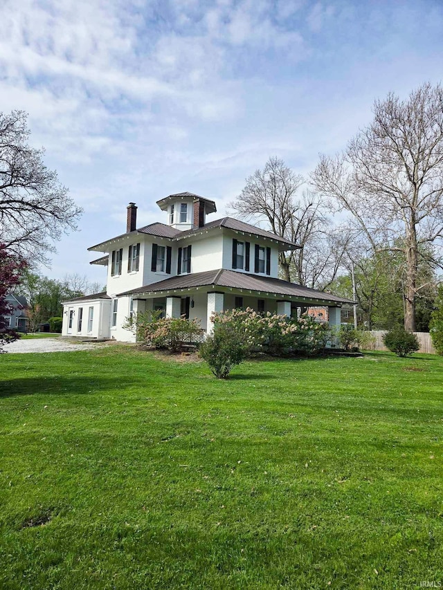 1106 E 5th St, Fowler, IN 47944 - view of front of home with fence, a chimney, and a front lawn