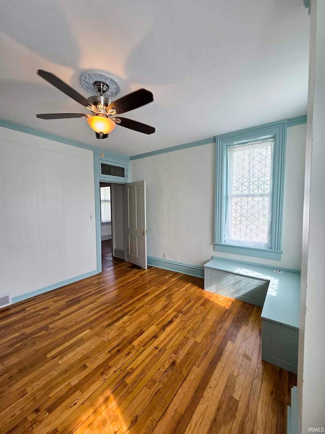 1106 E 5th St, Fowler, IN 47944 - unfurnished room with wood-type flooring, ceiling fan, and visible vents