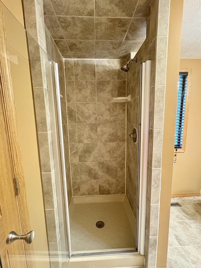 full bath featuring a shower stall