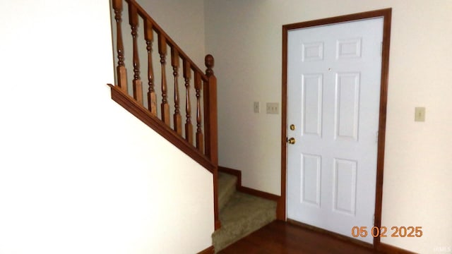 4214 Hunters Trce, Evansville, IN 47715 - entryway featuring baseboards, dark wood finished floors, and stairway