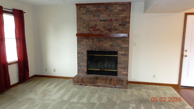 4214 Hunters Trce, Evansville, IN 47715 - unfurnished living room with carpet flooring, baseboards, and a fireplace