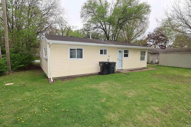 1421 E Ireland Rd, South Bend, IN 46614 - rear view of property with a yard