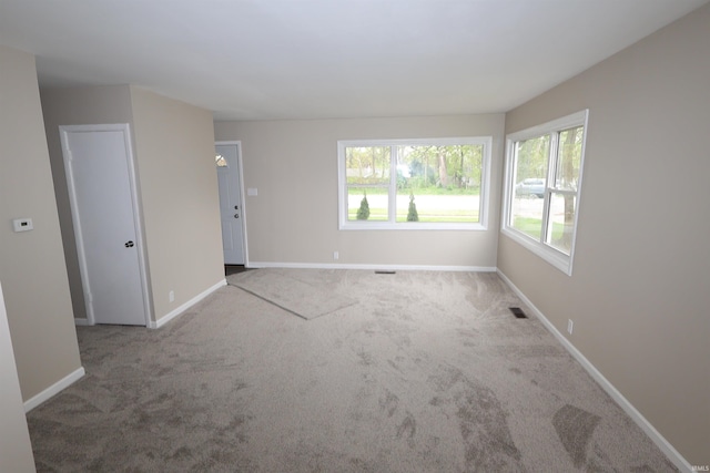 1421 E Ireland Rd, South Bend, IN 46614 - carpeted empty room featuring baseboards and visible vents