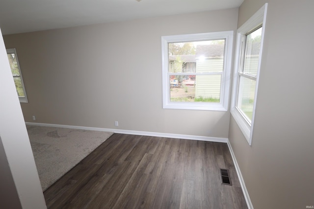 1421 E Ireland Rd, South Bend, IN 46614 - unfurnished room featuring baseboards, dark wood-style flooring, and visible vents