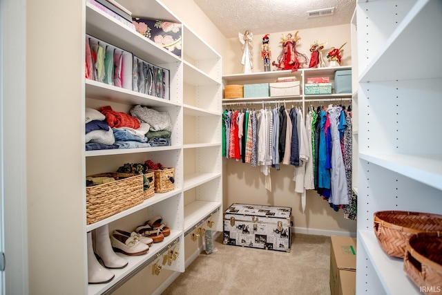 walk in closet with carpet flooring and visible vents