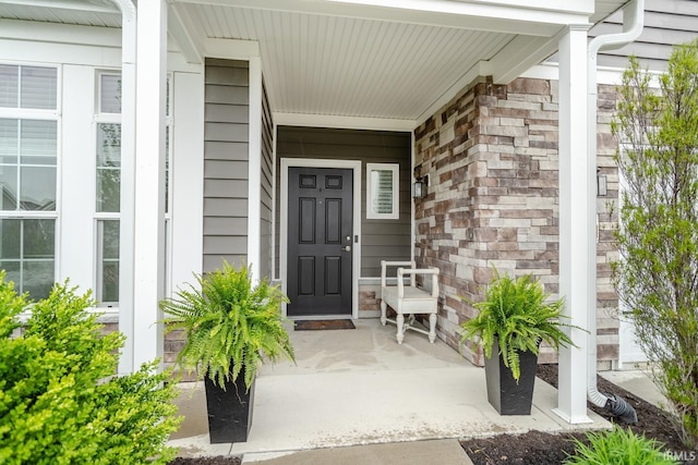 doorway to property with covered porch