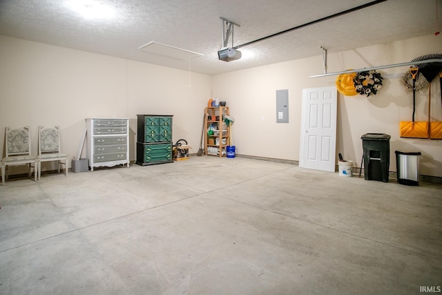 garage featuring a garage door opener and electric panel