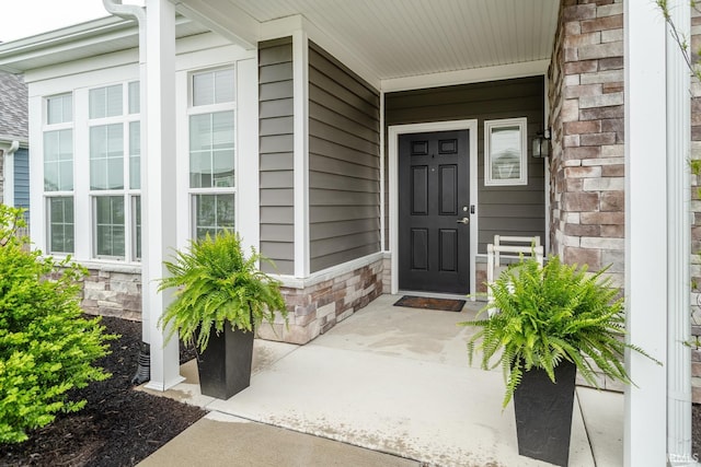 property entrance featuring covered porch