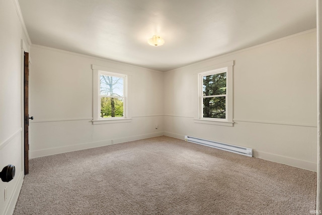 carpeted empty room featuring crown molding, baseboards, and baseboard heating