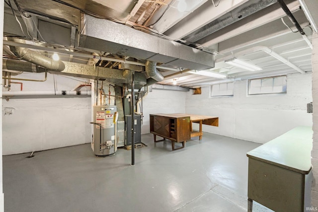 below grade area featuring heating unit and water heater