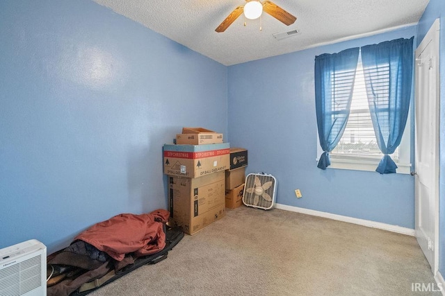 730 S Bell St, Kokomo, IN 46902 - interior space featuring visible vents, baseboards, ceiling fan, a textured ceiling, and carpet