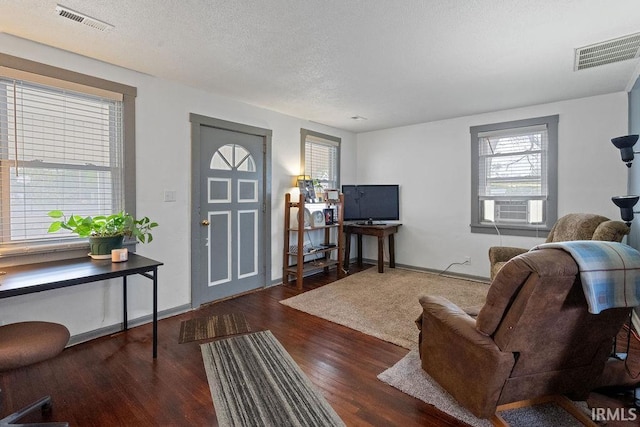 730 S Bell St, Kokomo, IN 46902 - living area with baseboards, wood finished floors, and visible vents