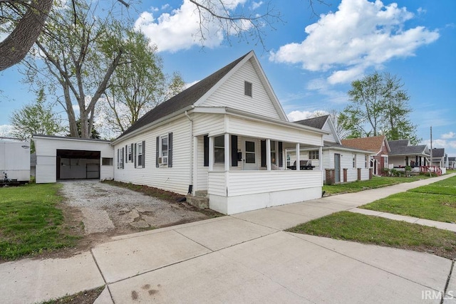 730 S Bell St, Kokomo, IN 46902 - view of front of property with an outbuilding, cooling unit, a front lawn, and dirt driveway
