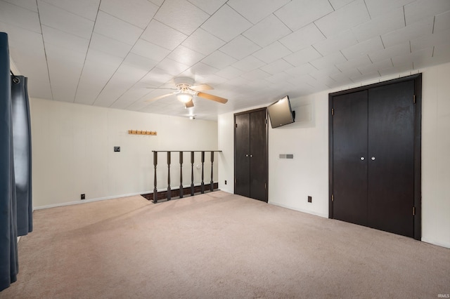 bonus room featuring carpet flooring, a ceiling fan, baseboards, and visible vents