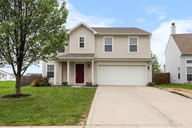 traditional home featuring concrete driveway, fence, a front lawn, and a garage