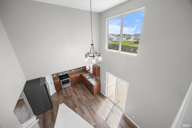 interior space featuring a chandelier and wood finished floors