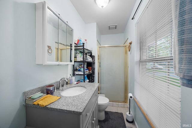full bath featuring toilet, a shower stall, tile patterned flooring, and vanity