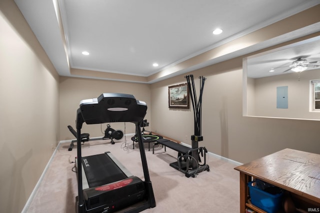 workout area featuring crown molding, carpet floors, baseboards, a raised ceiling, and recessed lighting