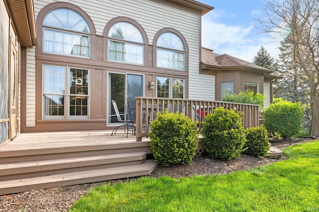 back of property with a deck