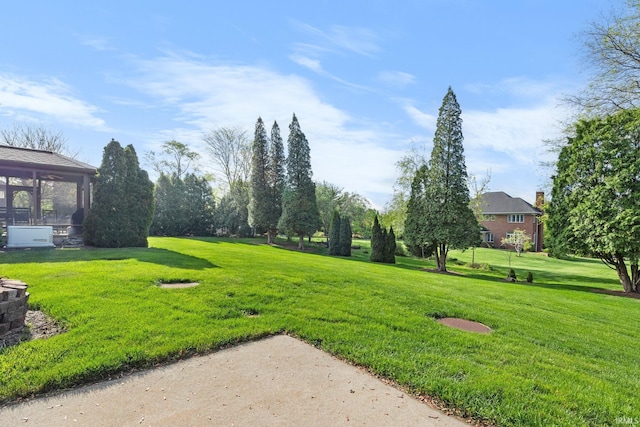 view of yard featuring a sunroom