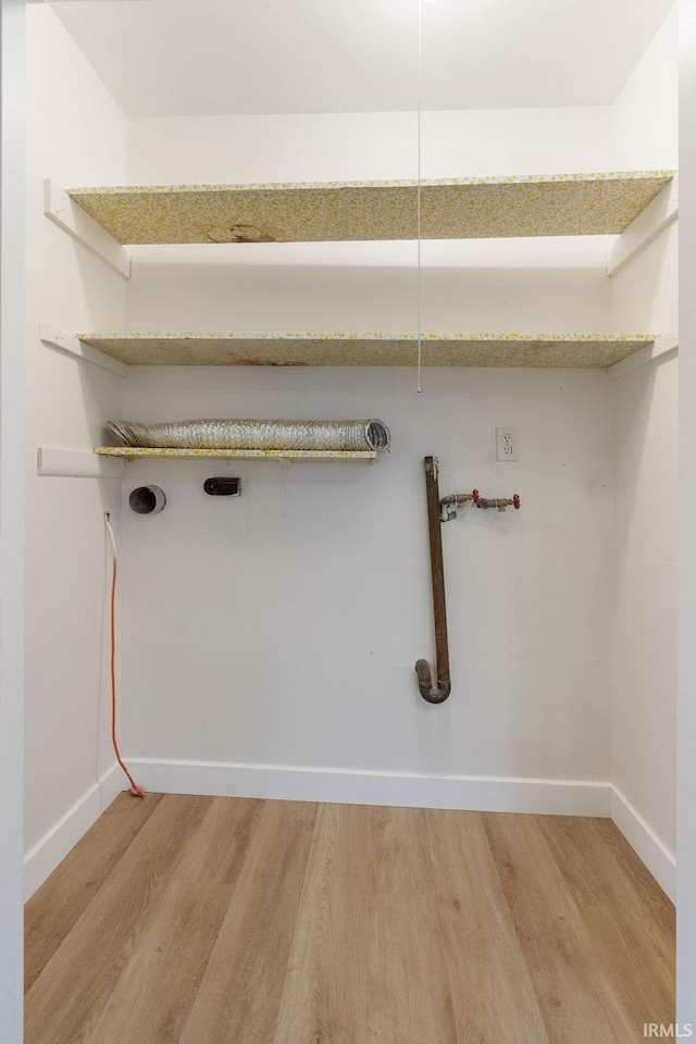 2031 Alton Dr, Kokomo, IN 46901 - washroom featuring laundry area, light wood finished floors, and baseboards