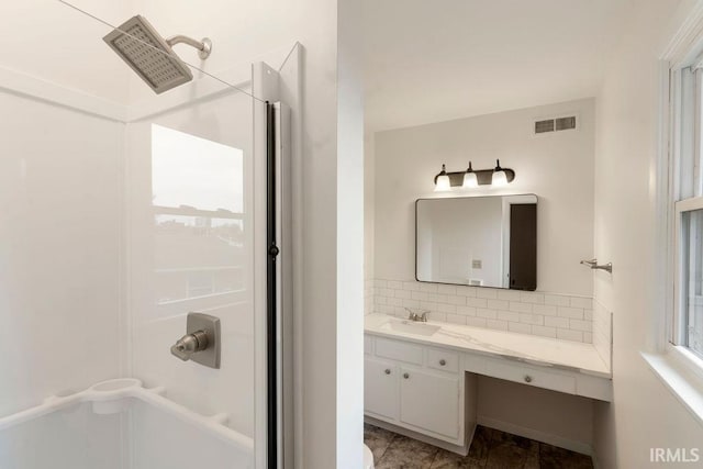 2031 Alton Dr, Kokomo, IN 46901 - bathroom with vanity, visible vents, and tasteful backsplash