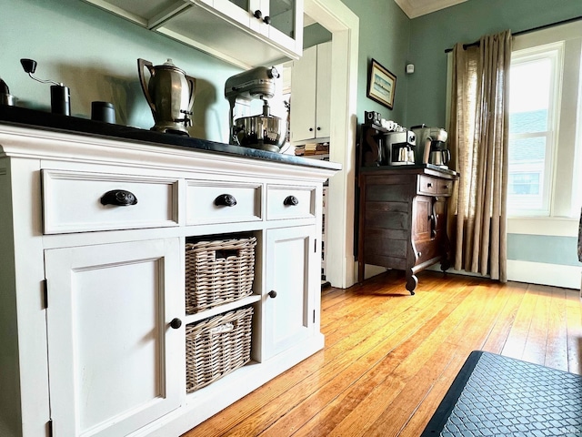bar featuring light wood-style flooring