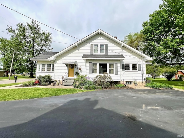 bungalow with a front lawn
